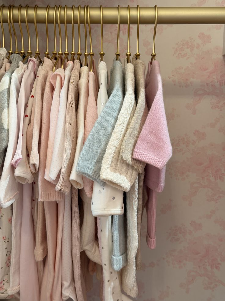 Newborn baby clothing checklist flat lay including organic cotton romper, bodysuit, hat and bib by Millie and Me Ireland