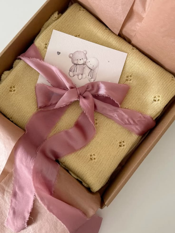 Beautifully wrapped organic cotton newborn baby gift from Millie and Me, an Irish baby brand — perfect for a baby shower or new arrival