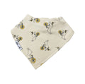 An off-white cotton bandana bib featuring a repeating pattern of cartoon rabbits carrying yellow and black shopping bags, with a small white brand tag reading 'Millie and Me' visible on one edge.