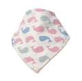 A triangular baby bib with a white background, featuring a pattern of pink, blue, and grey whales. The bib has a white fabric tag on the left side with the brand name 'Millie and Me'.