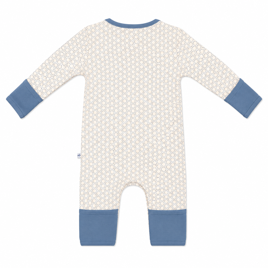 A baby long-sleeve footless romper with a cream and white geometric pattern, featuring solid blue cuffs and leg hems, shown flat on a white background.