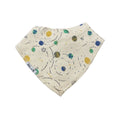 An off-white cotton bandana bib featuring a colorful space-themed print with planets, stars, and orbit lines in blue, green, and yellow, shown on a plain white background.