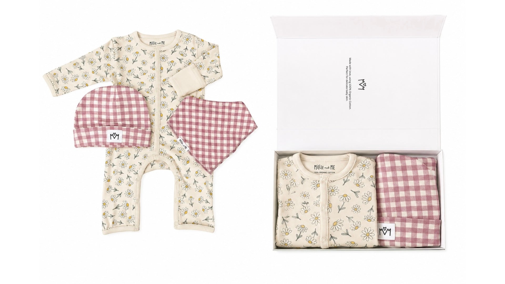 A baby clothing gift set shown both laid out and inside its white box. The set includes a cream-colored long-sleeve footless romper with a delicate floral print, a matching pink and white gingham bib, and a folded matching gingham blanket or swaddle.