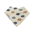 A triangular baby bib made of cream-colored fabric with a pattern of blue-gray and tan cartoon bunnies, featuring a white tag on the side.