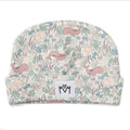 A baby beanie hat featuring a pastel underwater pattern with whales, octopus, and sea plants on a cream background, with a white fabric label with logo on the front cuff.