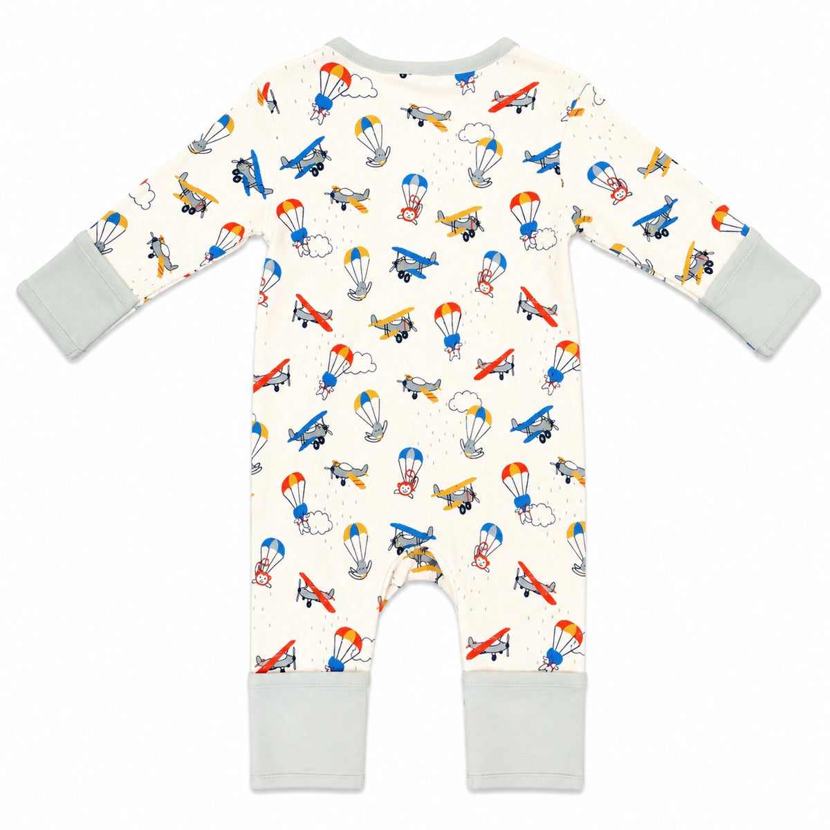 A baby's long-sleeve footless romper in cream with a colorful airplane and parachute pattern, featuring light gray cuffs and leg cuffs, shown flat on a white background.