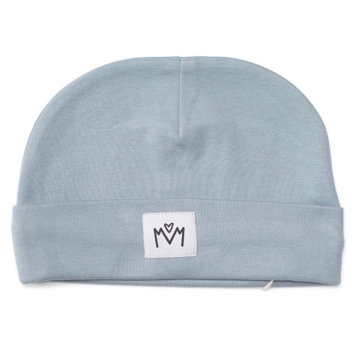 A light blue knit baby beanie hat with a folded cuff, featuring a small white square patch on the front with a black embroidered logo.