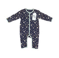 A baby long-sleeve footless sleeper in navy blue with a white and gold space-themed print of stars, moons, and rockets, featuring a white hangtag.