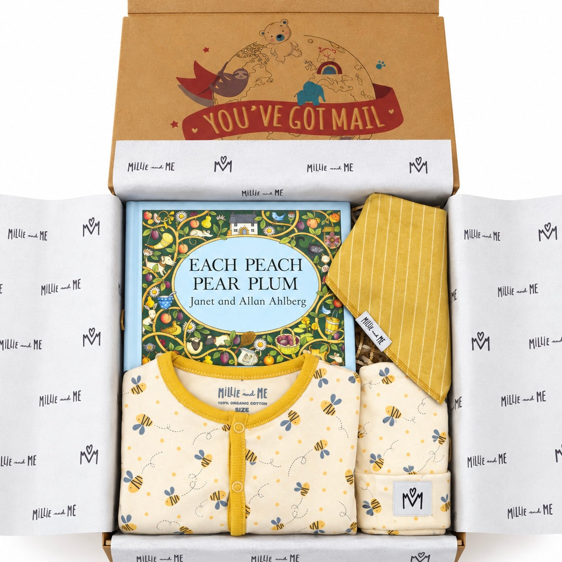 A curated gift box set from Millie and Me featuring a baby romper and matching hat in a soft yellow and cream bee print, a striped yellow knit bandana bib, a book titled 'Each Peach Pear Plum' by Janet and Allan Ahlberg, and a brown kraft box printed with 'You've Got Mail'.