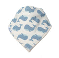 A triangular baby bib or bandana-style cloth with an allover whale print in shades of blue on an off-white background, finished with a striped border.