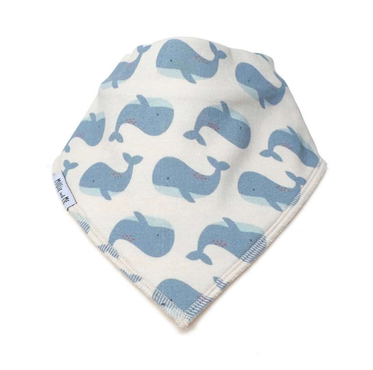 A triangular baby bib or bandana-style cloth with an allover whale print in shades of blue on an off-white background, finished with a striped border.