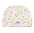 A star patterned beanie hat with a folded cuff, featuring a small white square patch on the front with a black embroidered logo.