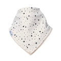 An off-white baby bandana bib with a black star and dot pattern, featuring a small side tag that reads 'Millie and Me'.