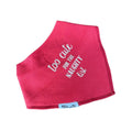 A pink bandana with white embroidered text reading 'too cute for the naughty list' and a small white 'Millie and Me' brand tag, shown on a white background.