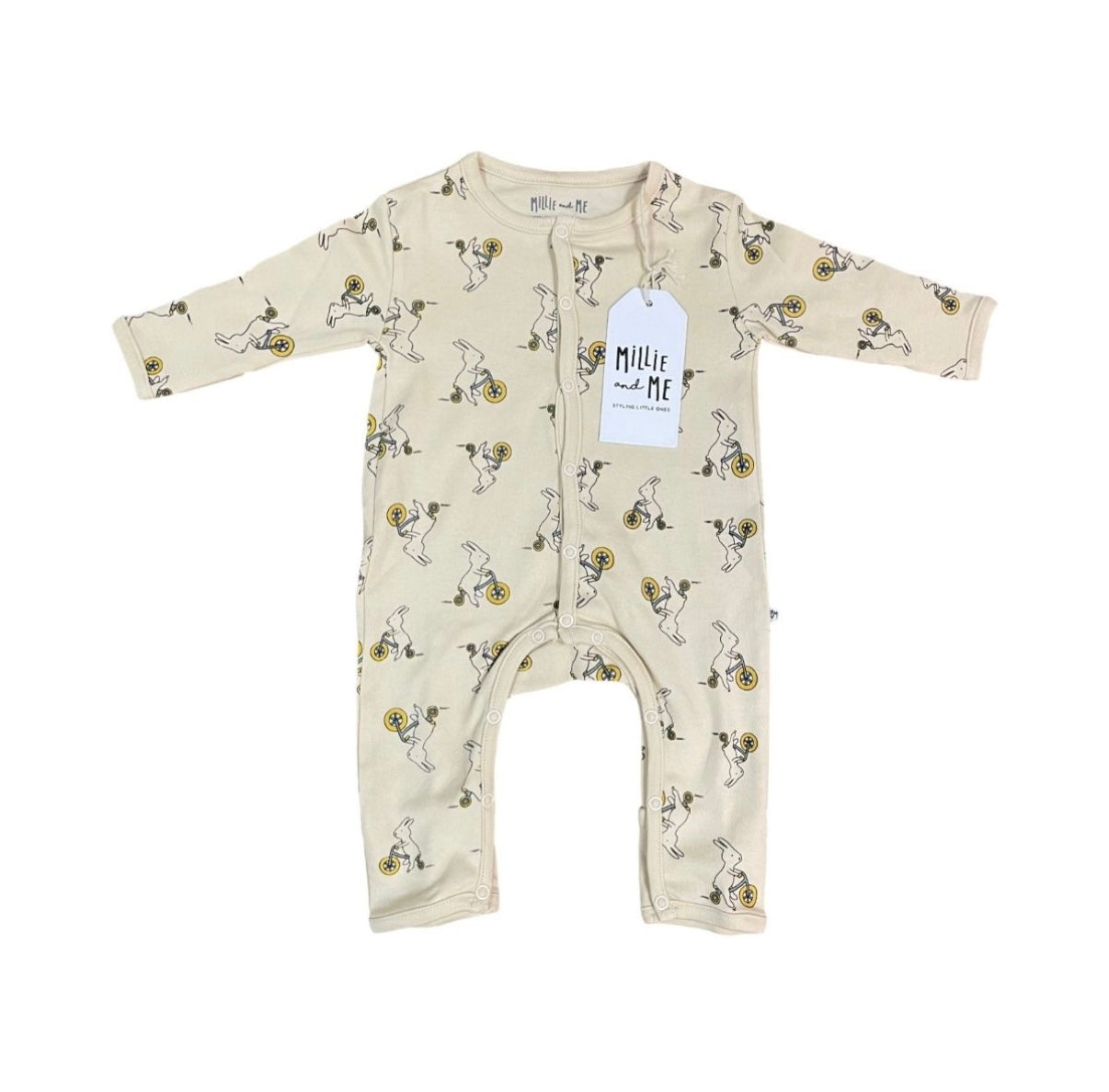 A baby long-sleeve footless one-piece romper in cream with a black and yellow cartoon rabbit print, featuring a white hangtag that reads 'Millie and Me'.