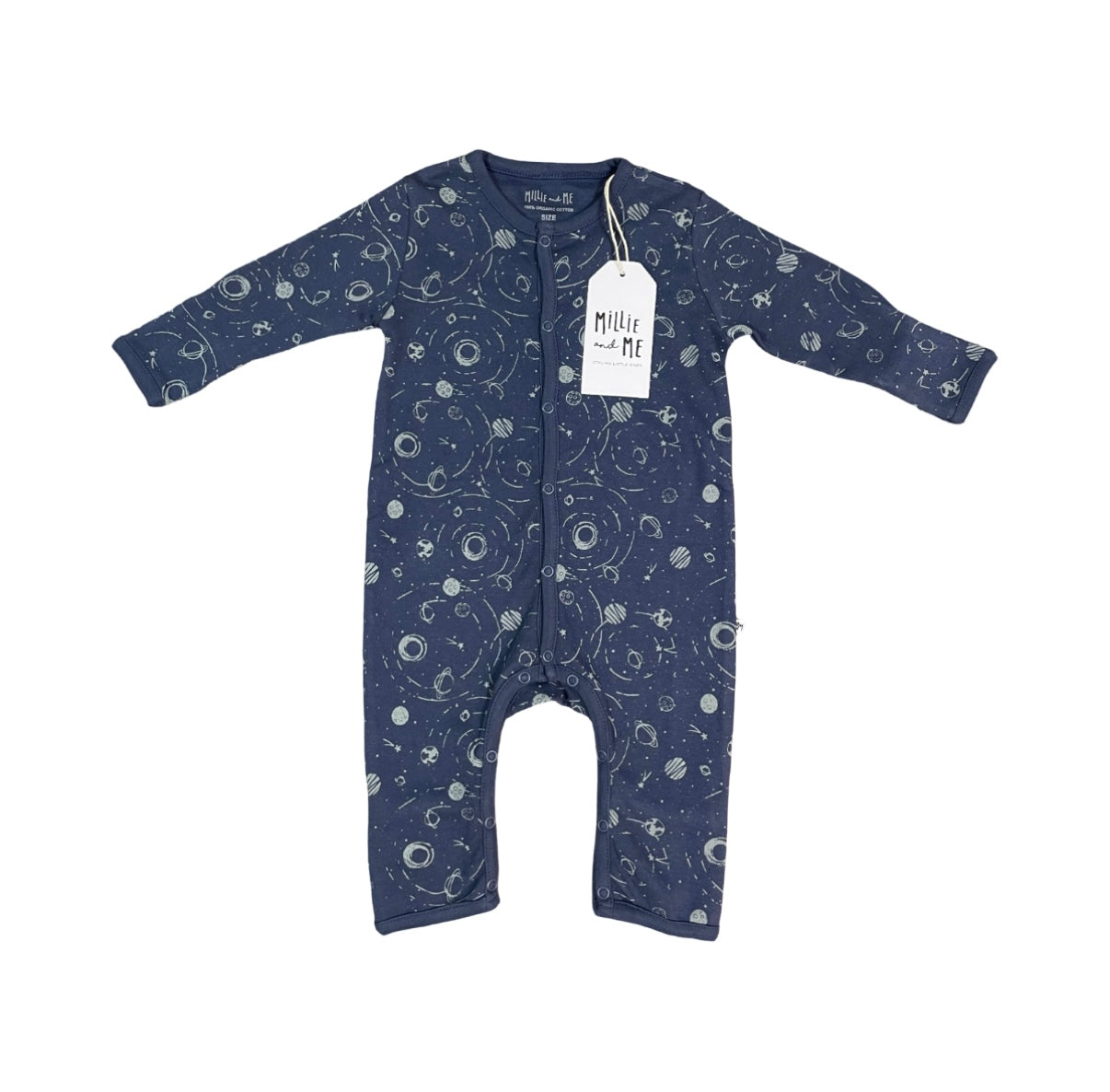 A baby long-sleeve footless one-piece sleeper in navy blue with a white space-themed print of stars, planets, and orbits. The garment has a white paper brand tag hanging from the collar, set against a plain white background.
