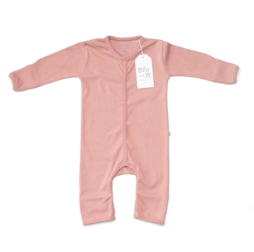 A dusty pink long-sleeve baby footless one-piece romper with a white hangtag, laid flat on a white background.