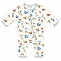 A baby long-sleeve footless one-piece sleeper with a light blue zipper and trim, featuring an all-over retro airplane and hot air balloon pattern on a cream background.