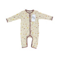 A baby long-sleeve footless sleeper in cream with a brown and yellow pattern, featuring brown trim and a white hangtag that reads 'Millie and Me'.