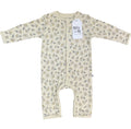 A long-sleeve baby footless one-piece romper in cream with a delicate all-over floral print, featuring a white paper brand tag that reads 'Millie and Me'.