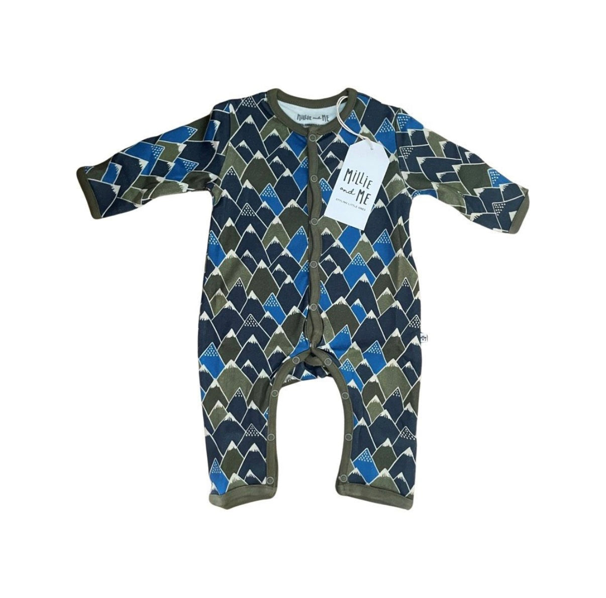 A baby long-sleeve footless one-piece sleeper with a geometric argyle pattern in navy, blue, olive green, and white. It features a front zipper closure and a white paper tag that reads 'Millie and Me'.