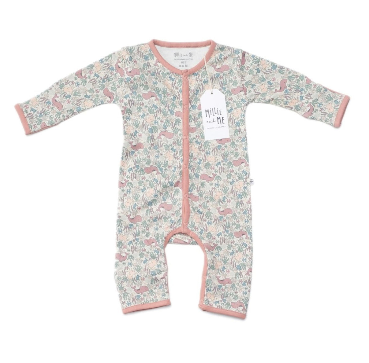 A floral print one-piece outfit with dusty pink accents.
