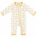 A baby long-sleeve footless one-piece sleeper in cream with a yellow and blue bee pattern, yellow trim, and a yellow zipper closure. The brand 'Millie and Me' is visible on the inner neck label.