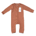 A long-sleeve baby footless romper in a warm terracotta or rust color, shown flat on a white background with its white paper tag attached.