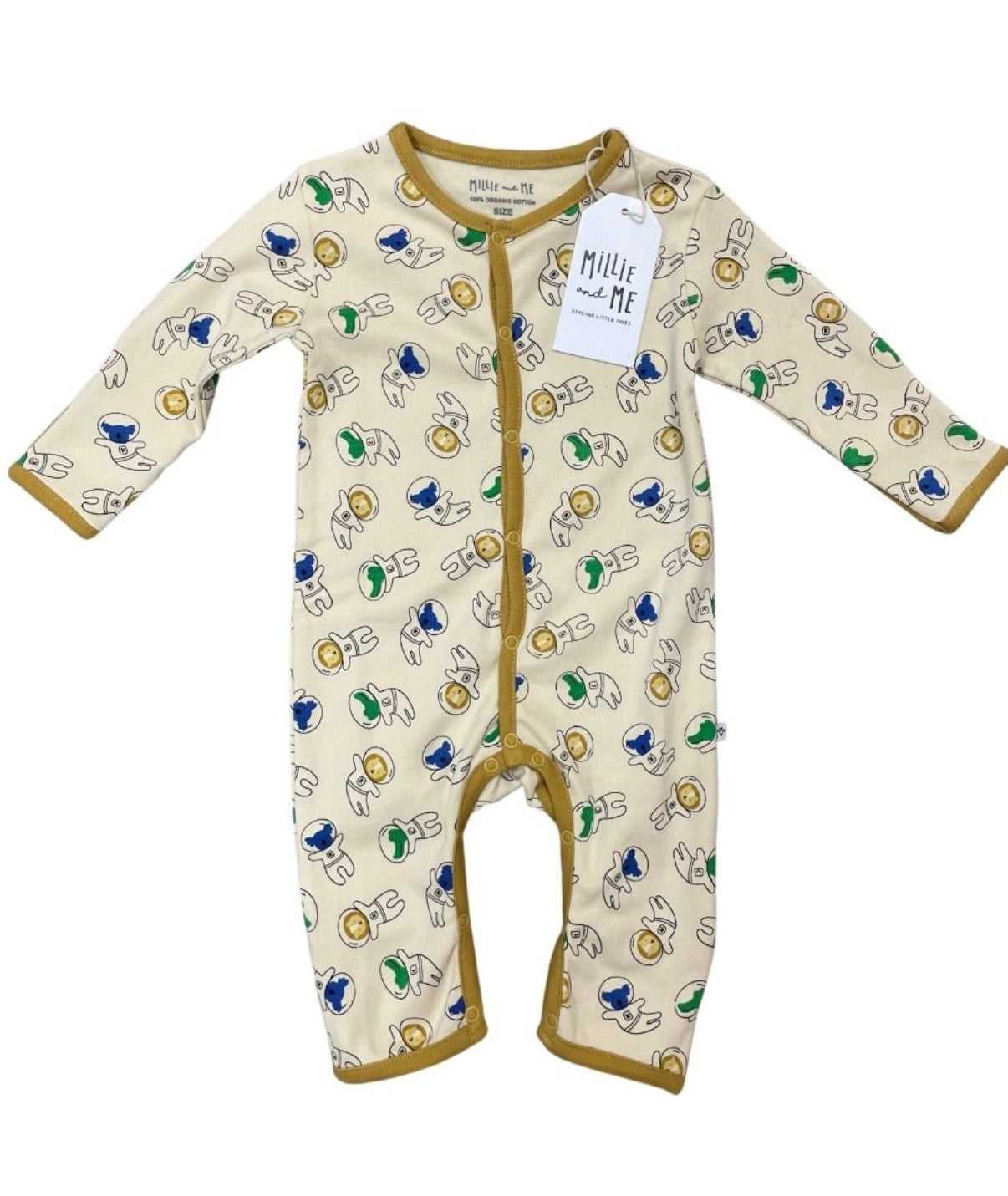 A baby long-sleeve footless one-piece sleeper in cream with a colourful cartoon print and tan trim, featuring a white hangtag with the brand name 'Millie and Me'.