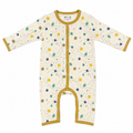 A baby long-sleeve footless sleeper with an off-white background and a colorful space-themed print of planets, stars, and dots. It features mustard yellow trim along the zipper, cuffs, and leg openings.