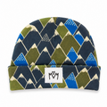 A folded knit beanie hat featuring a geometric mountain pattern in navy blue, olive green, bright blue, and cream, with a white fabric brand patch on the cuff.