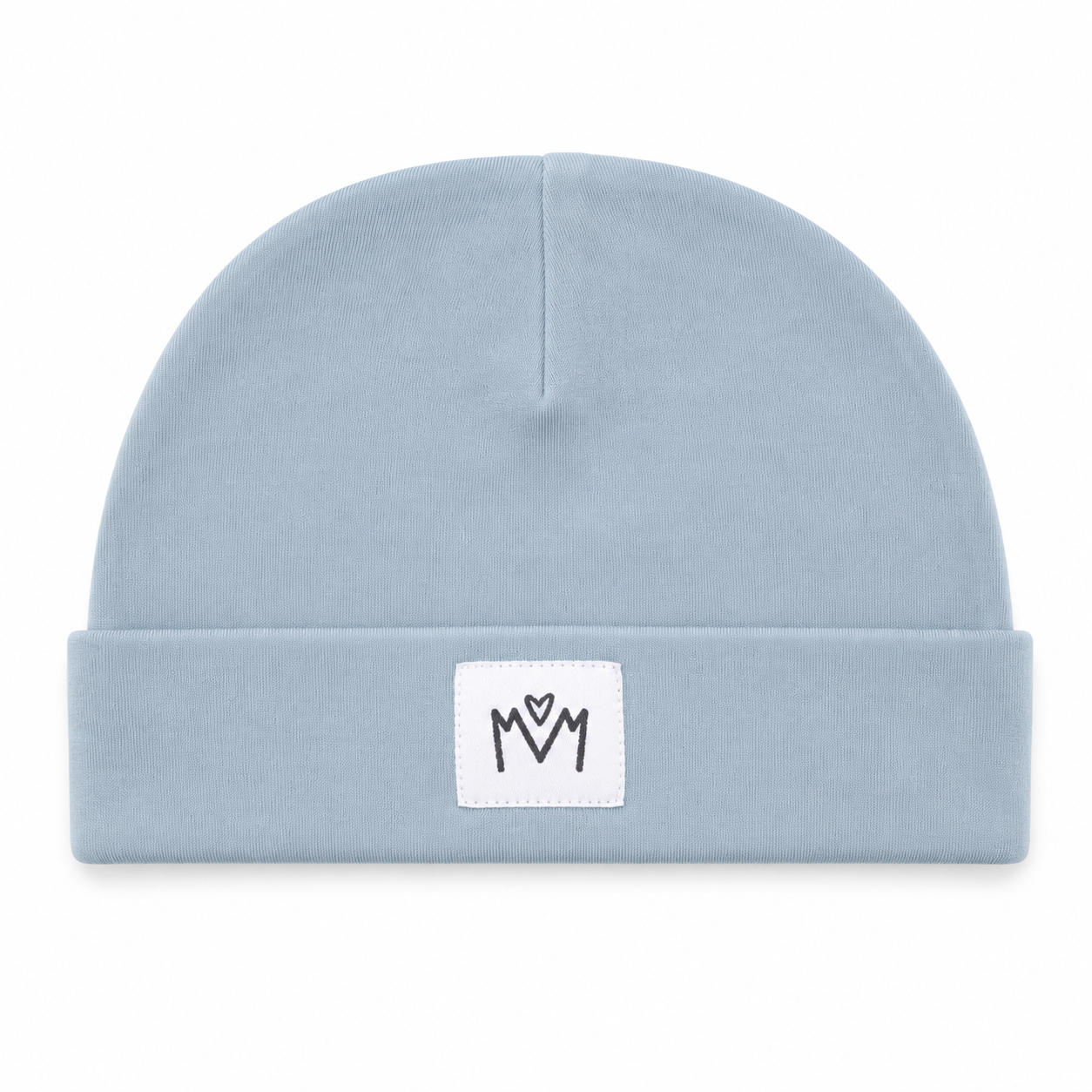 A light blue knit beanie hat with a folded cuff, featuring a small white square patch on the front with a black embroidered 'M' logo.