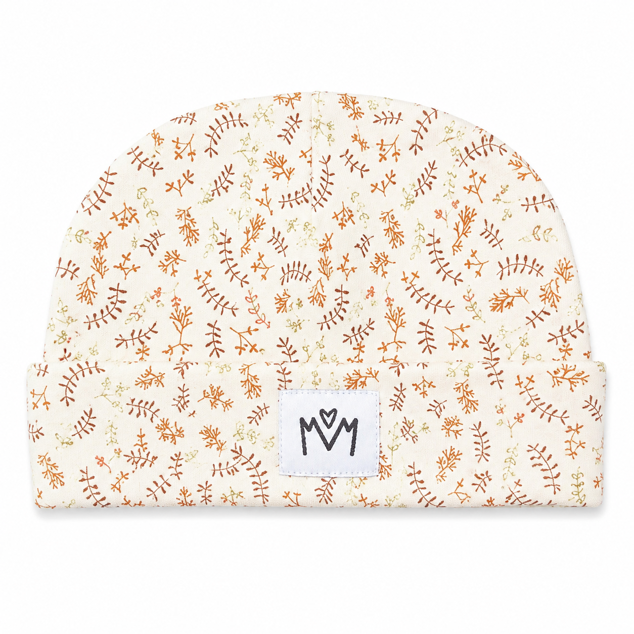 A baby beanie hat featuring an all-over delicate botanical pattern in warm brown and orange on an off-white background, with a white brand patch displaying 'M M' on the front.