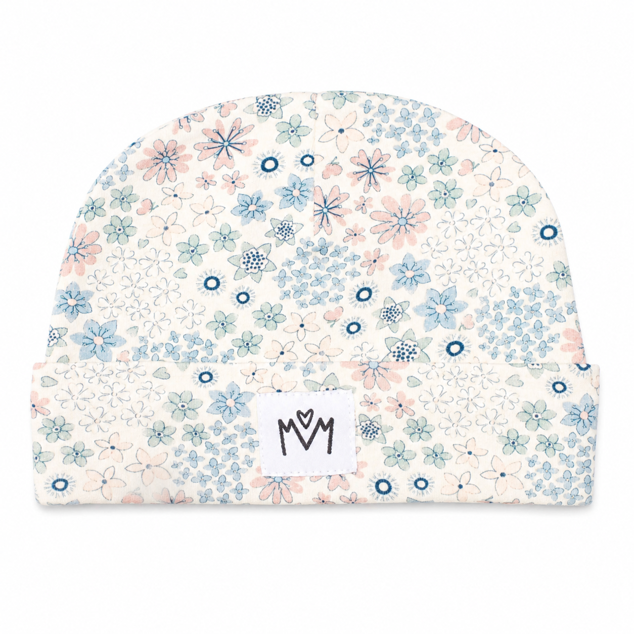 A baby beanie hat featuring a delicate floral pattern in shades of blue, pink, and green on an off-white background, with a white fabric label showing a black 'M M' logo on the front fold.
