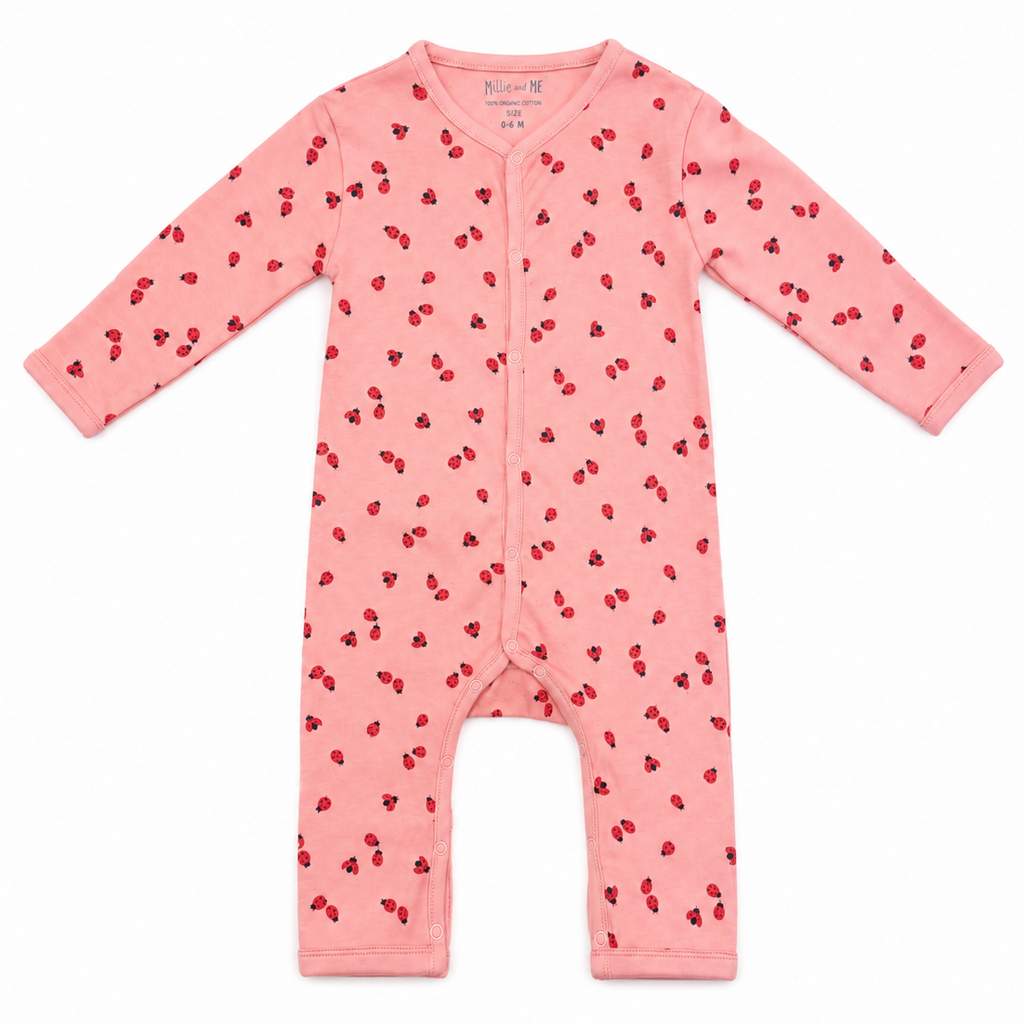A pink long-sleeve baby footless one-piece jumpsuit with an all-over red cherry print, shown flat on a white background.