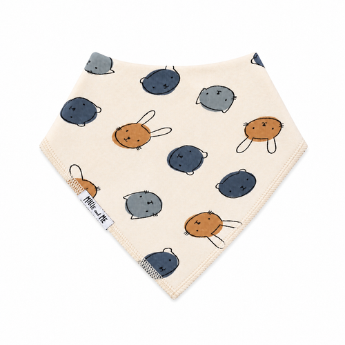 Millie and Me Bandana Bib in Bunny Face Dots Citadel – organic cotton baby bib with an all-over cute bunny and bear faces print in slate blue and warm tan on a cream background, Millie and Me label detail