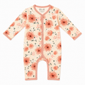 A baby long-sleeve footless one-piece romper with a coral and pink floral print on a cream background, featuring pink buttons and trim.