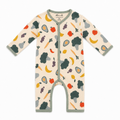 A baby long-sleeve footless romper in cream with a colorful fruit and vegetable print, featuring sage green trim and a snap closure.