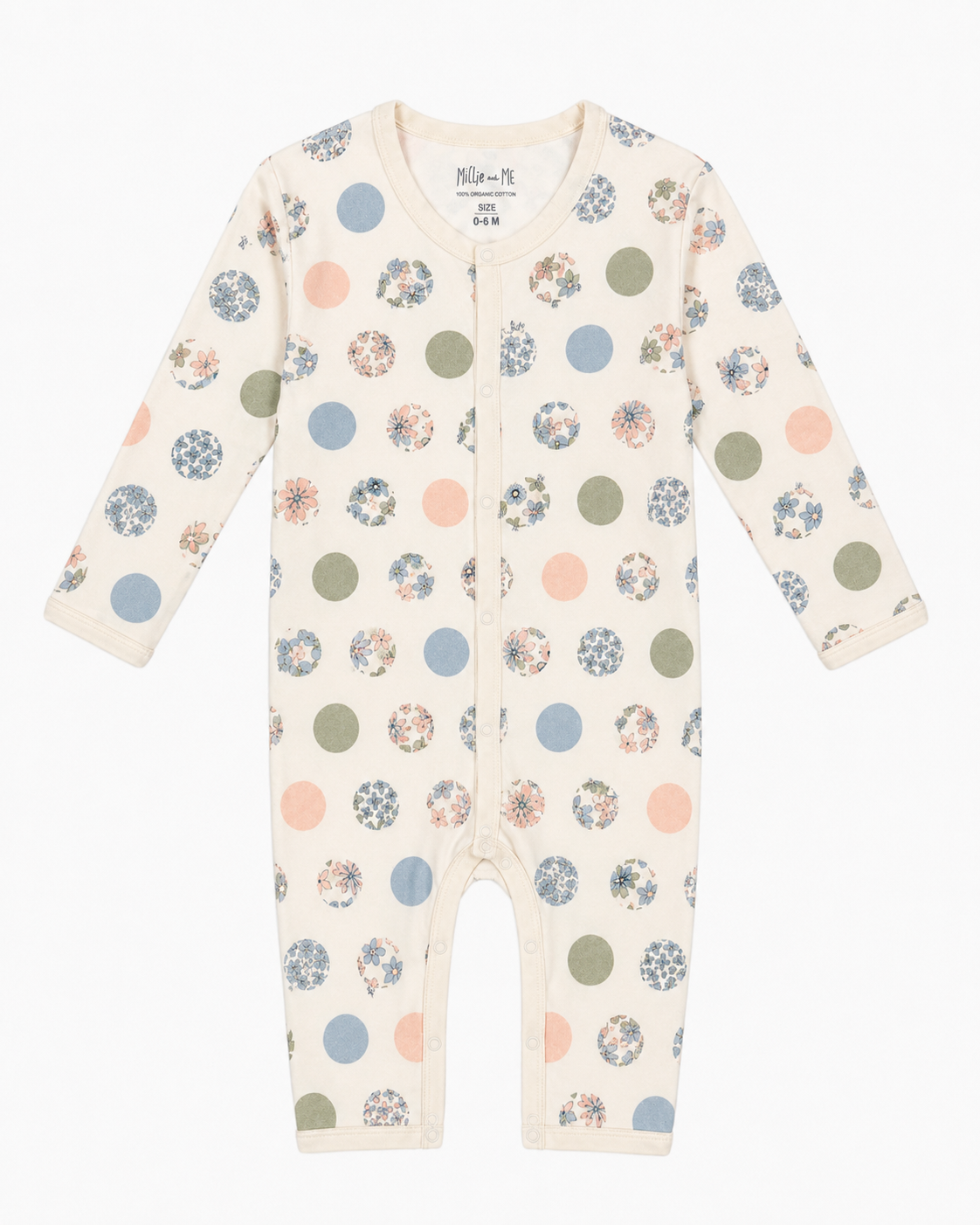 A long-sleeve baby footless one-piece romper in cream, decorated with a pattern of polka dots in muted blue, green, pink, and floral prints. The brand name 'Millie and Me' is visible on the inner neck label.