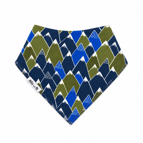 Millie and Me Bandana Bib in Alpine Mountains – organic cotton baby bib with a bold geometric mountain peaks print in navy, olive green and cobalt blue with white snow-capped tops, Millie and Me label detail