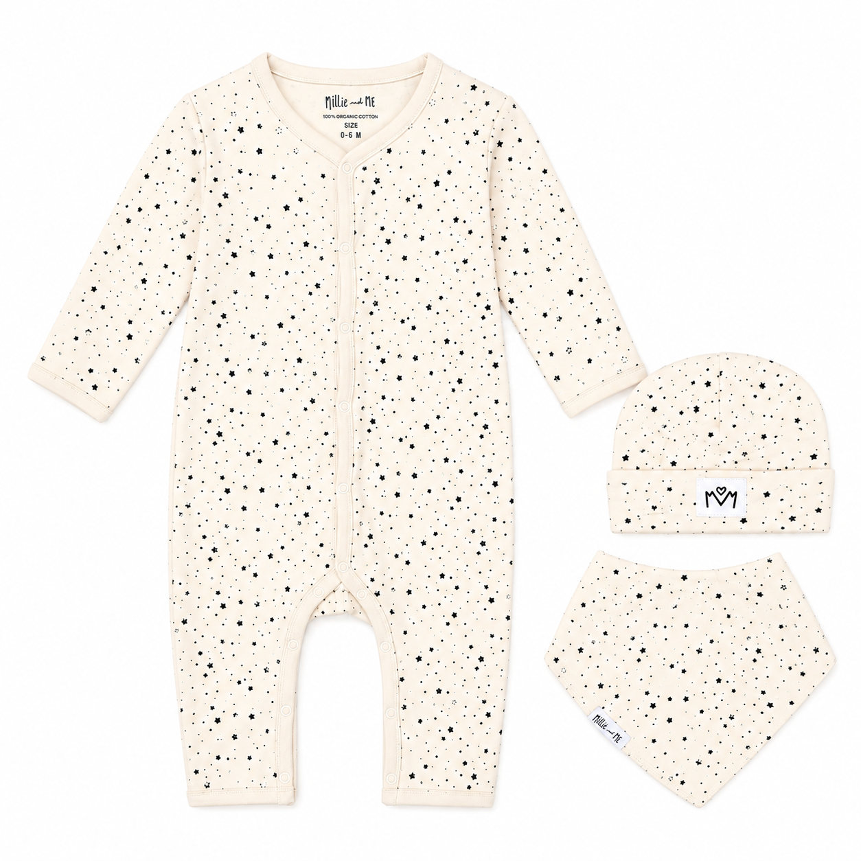 A three-piece baby clothing set including a long-sleeve footless romper, a beanie, and a bandana bib, all in an off-white/cream colour with a small black speckled pattern. The brand name 'Millie and Me' is visible on the inner neck label and on the beanie.