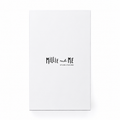 A tall, minimalist white gift box standing upright on a white background. The box features the text 'Millie and Me' in a black handwritten-style font, with 'STYLING LITTLE ONES' printed underneath in smaller text.