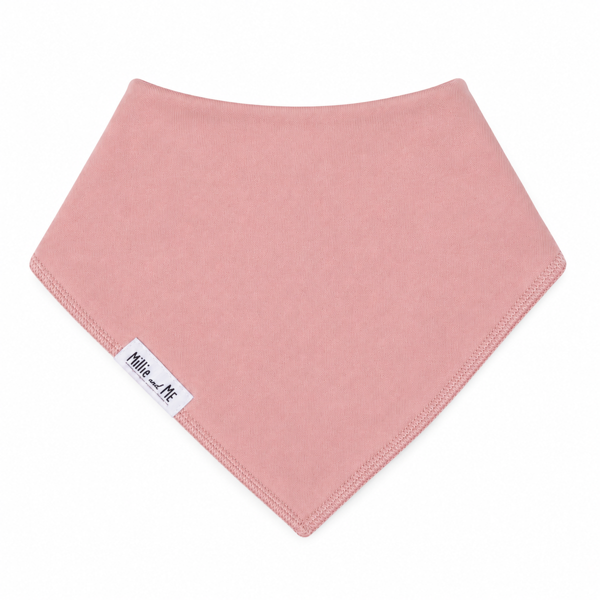A dusty pink triangular bandana bib with a white 'Millie and Me' brand label on the lower left corner, shown on a plain white background.
