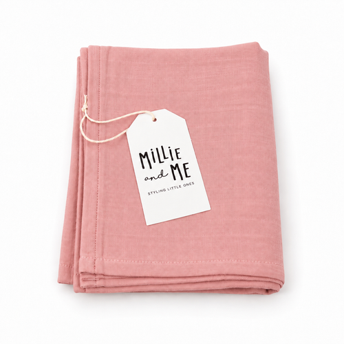 Millie and Me Ash Rose Muslin Cloth, folded and presented with its branded tag, featuring a soft muted rose-pink tone and a 100% organic cotton muslin texture.