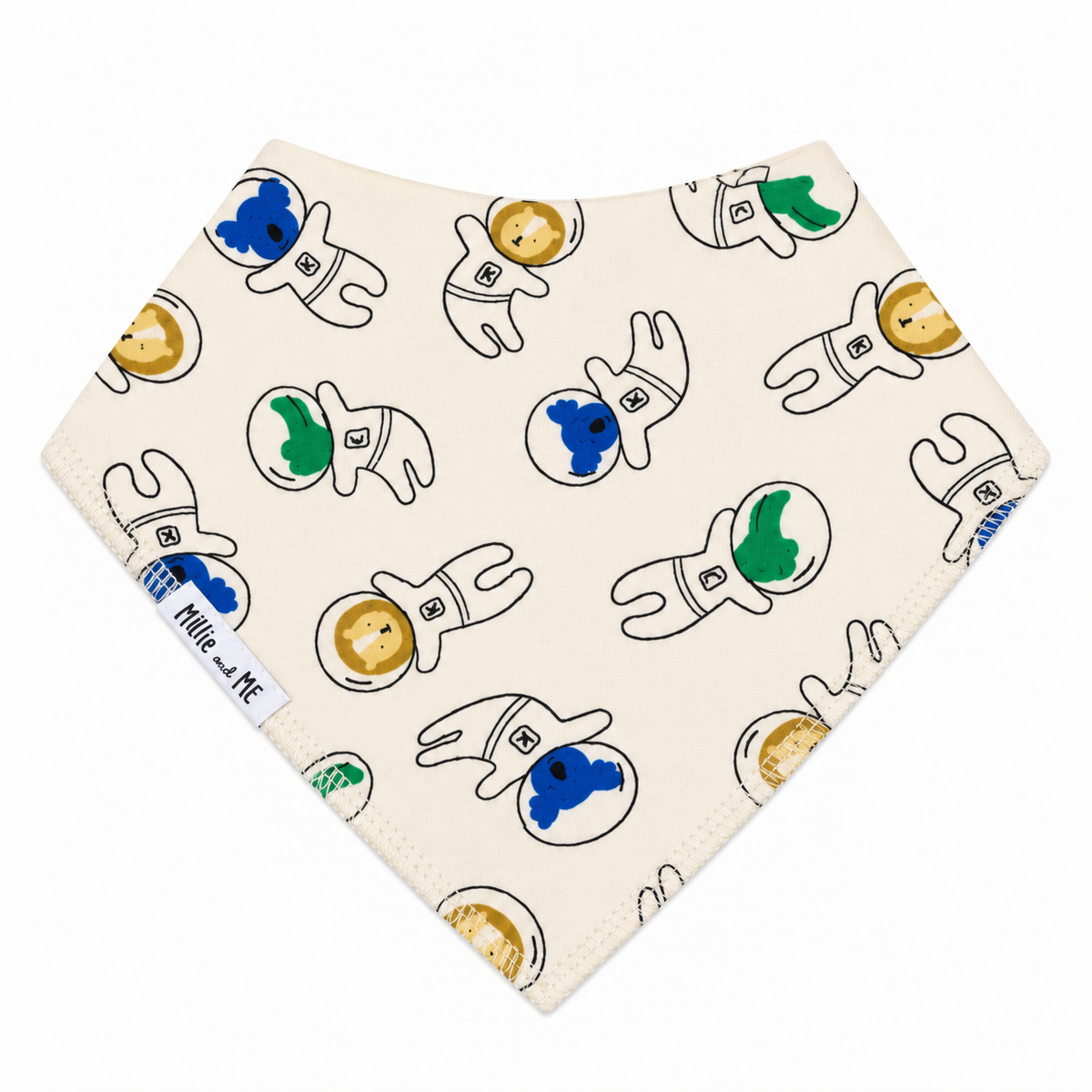 A triangular bandana-style bib with an off-white background, featuring a playful pattern of hand-drawn astronauts in white suits with blue, green, and gold accents. A white fabric tag on the left side reads 'Millie and Me'.