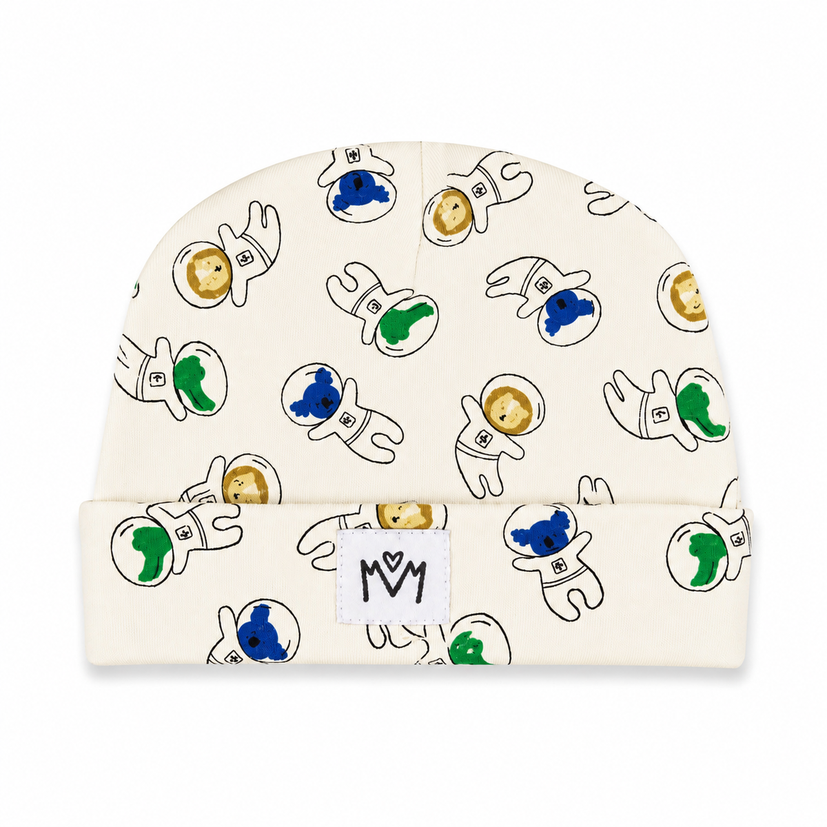 An off-white knit baby beanie featuring a playful pattern of cartoon astronauts in black outlines with blue, green, and gold accents. A small white fabric patch with a black 'MM' logo is sewn onto the folded cuff.