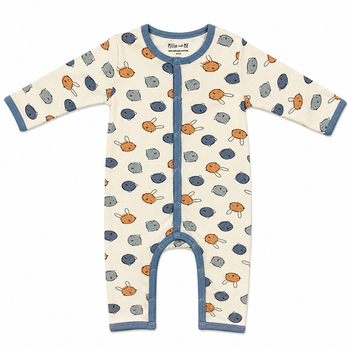 A long-sleeve baby footless one-piece sleeper with an off-white background, featuring a pattern of orange bunnies and blue-grey eggs, with blue trim on the collar, cuffs, and snap-button front.