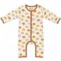 A long-sleeve baby footless romper in cream with a playful cartoon animal print in yellow, orange, and pink, featuring orange trim.