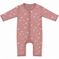 A baby long-sleeve footless one-piece sleeper in dusty rose pink with a white celestial pattern of stars, planets, and swirls, featuring snap buttons down the front.