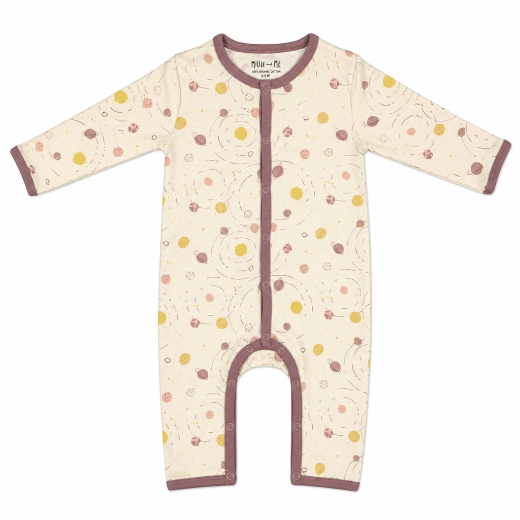 A baby long-sleeve footless sleeper with a cream base, brown trim, and a pattern of small yellow, brown, and pink dots and lines, shown flat on a white background.
